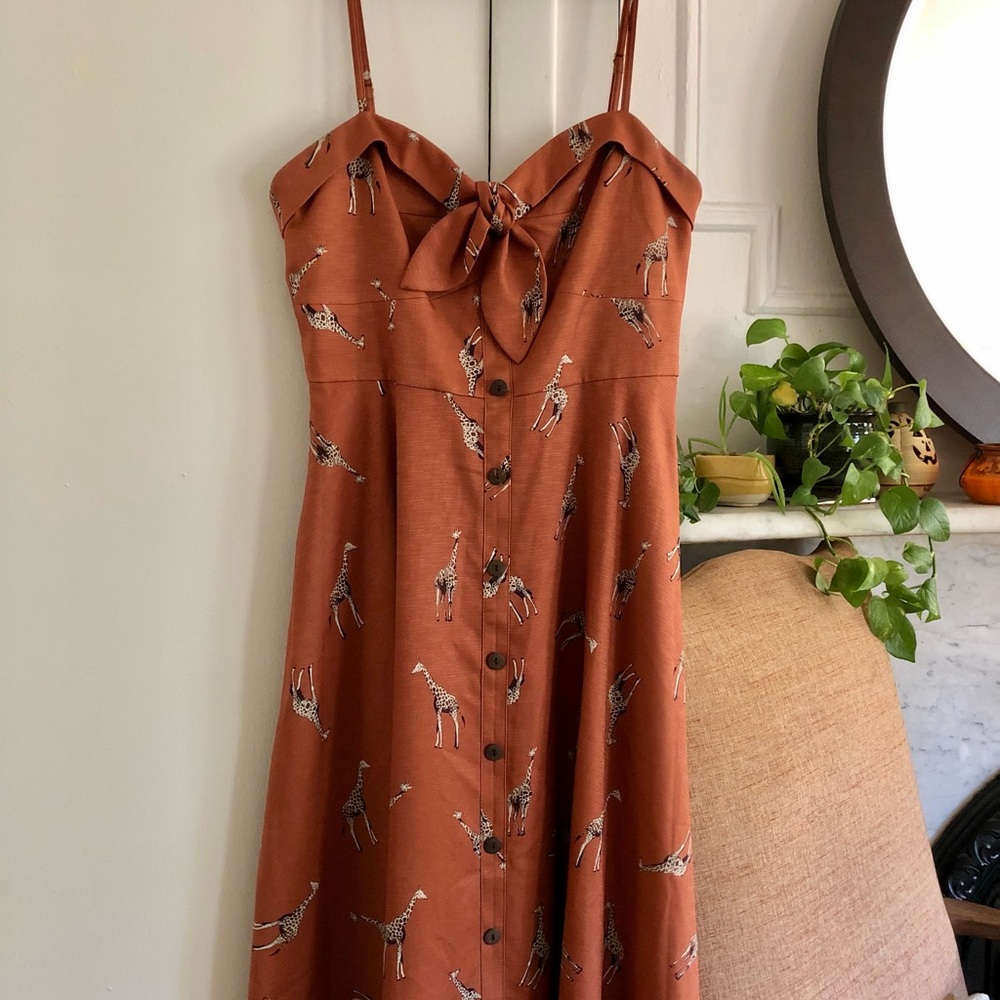 Orange midi dress with giraffes